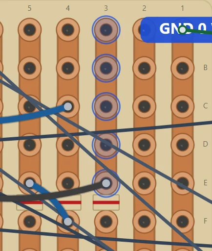 Copper face close-up: columns 5 to 1 run left to right; the three gaps between E and F break E5–F5, E4–F4 and E3–F3.